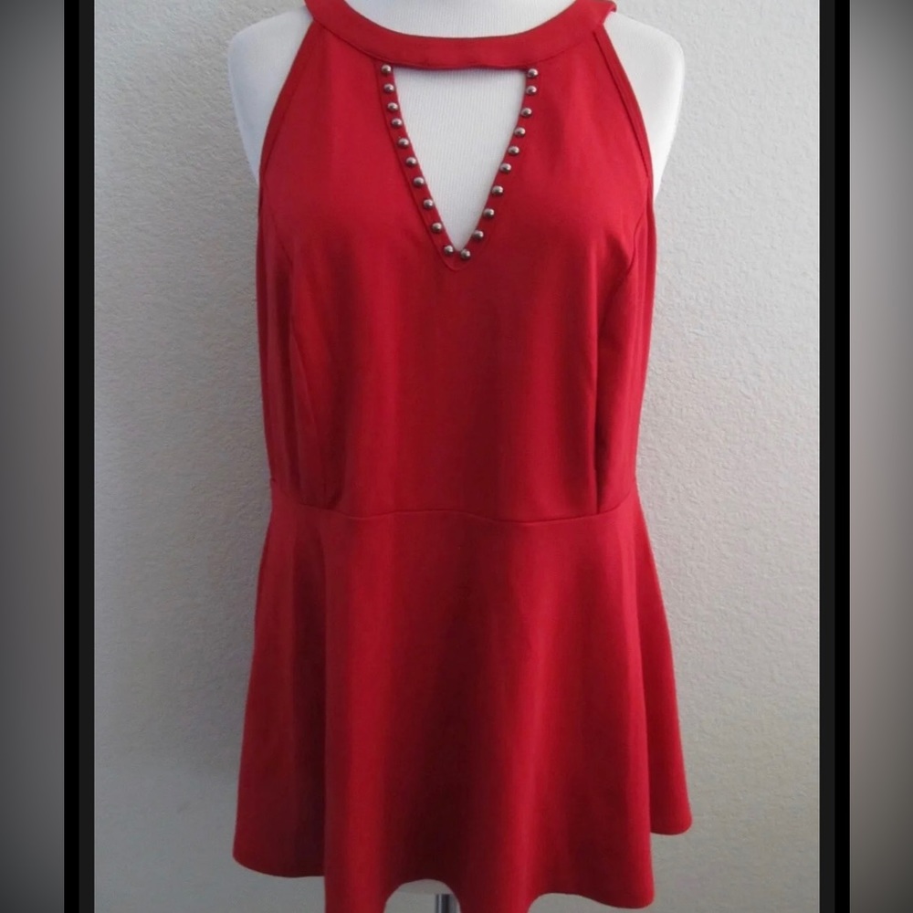 Red sleeveless knit torrid blouse with key hole.  Zip up back.